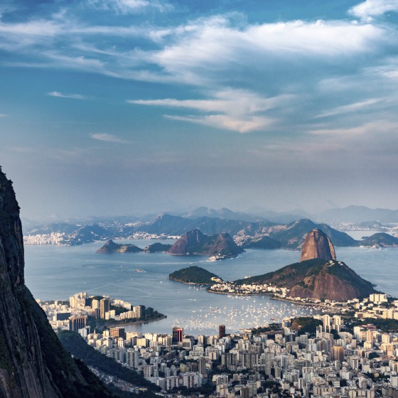 Aerial view of Rio De Janeiro. Corcovado mountain with statue of Christ the Redeemer, urban areas of Botafogo, Flamengo and Centro, Sugarloaf mountain.